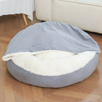 Grey cave dog bed with hood fully open — revealing deep white plush interior and rounded shape